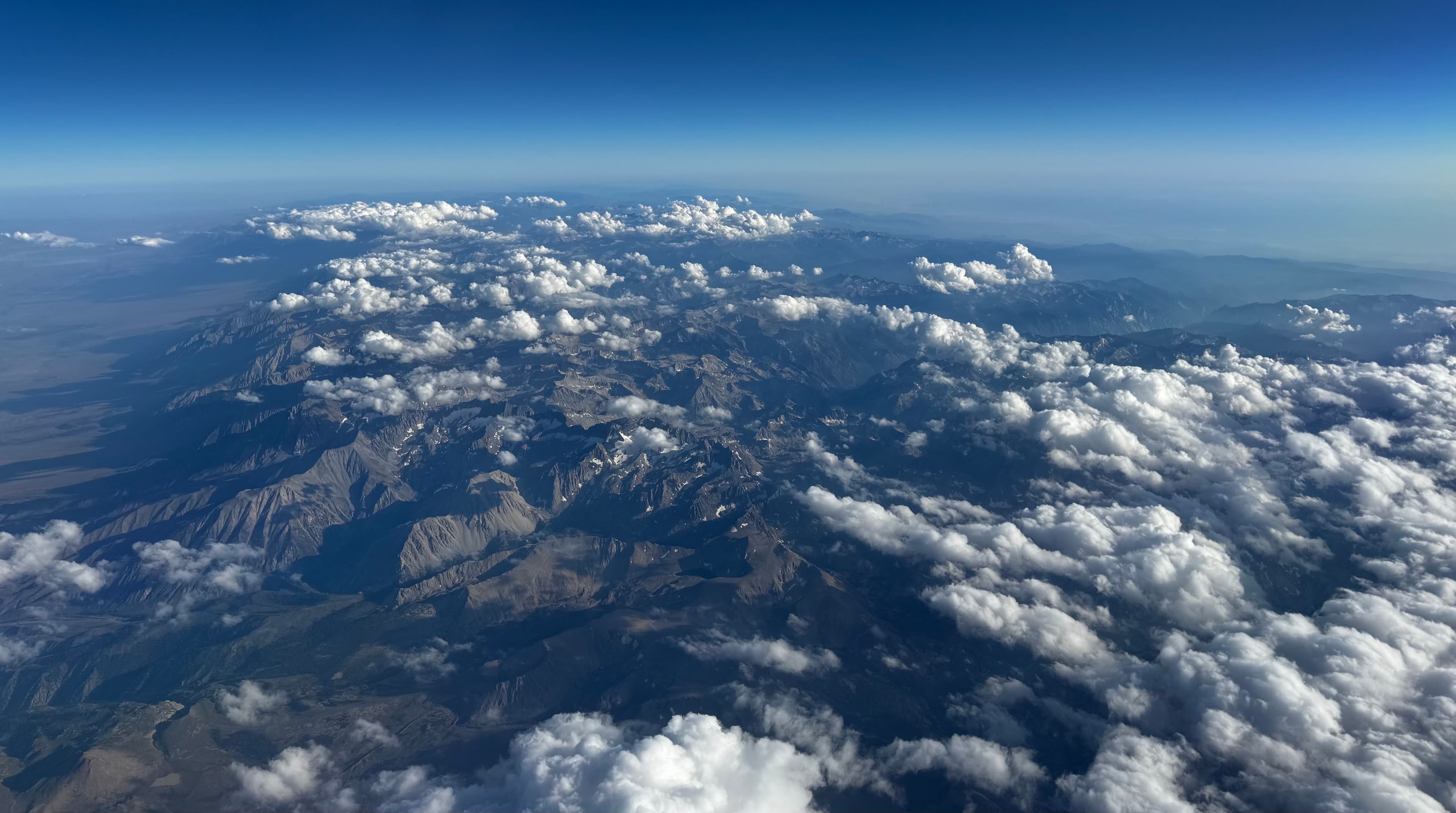 The Sierra Nevada mountain range viewed from an airplane window